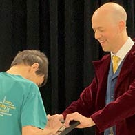 An employee is making the magic happen at a workplace show in Minnetonka, MN.