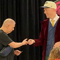 An employee is making the magic happen at a workplace show in Minnetonka, MN.